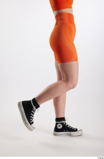Unaisa  1 black sneakers dressed flexing leg orange bike…